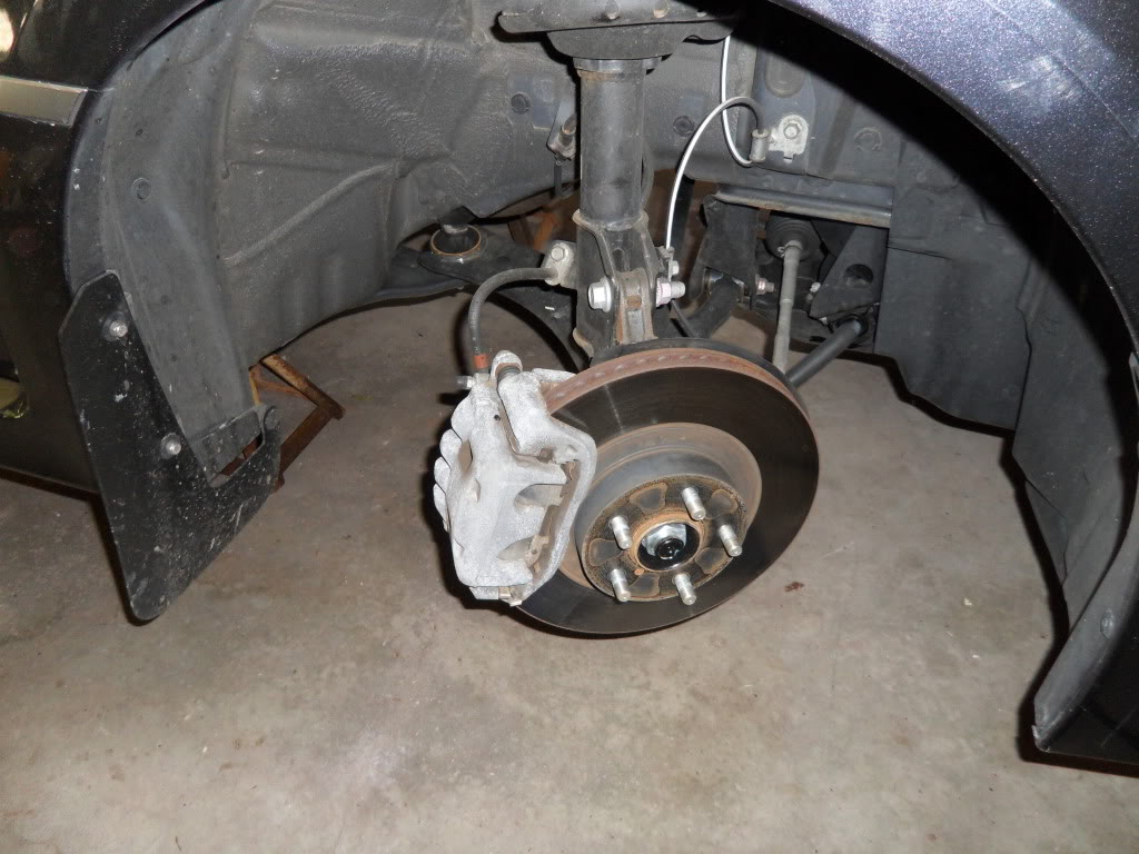 Brake pad: A Subaru Impreza WRX stock brake caliper.