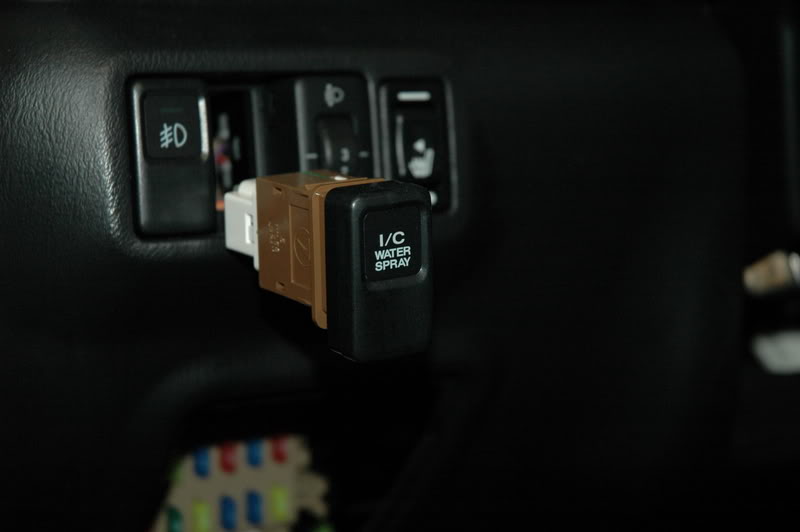 JDM Automatic Intercooler Switch: The USDM stock STi switch that you will be removing.