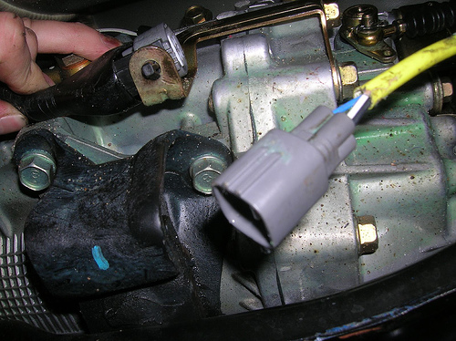 Short Shifter: O2 sensor is held by two plastic clips that can be pushed out of the holes in the member without much trouble.