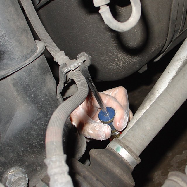Spring: Rear brake line clip. Get a flathead screwdriver under it, then tap the screwdriver with a hammer from below.