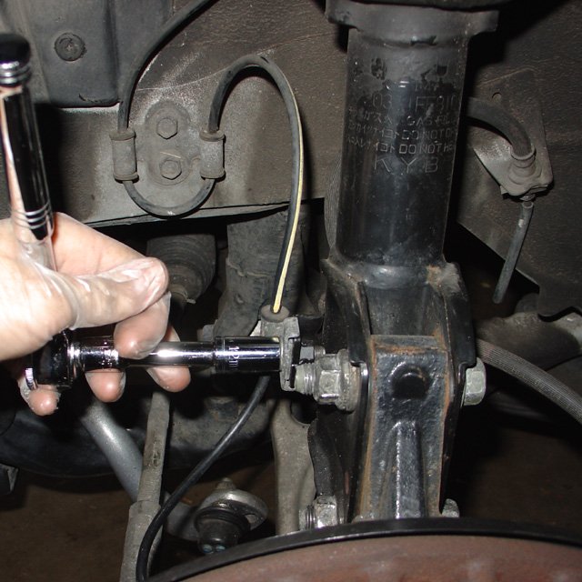 Spring: Remove the bolts (12mm) for the front ABS and brake lines.