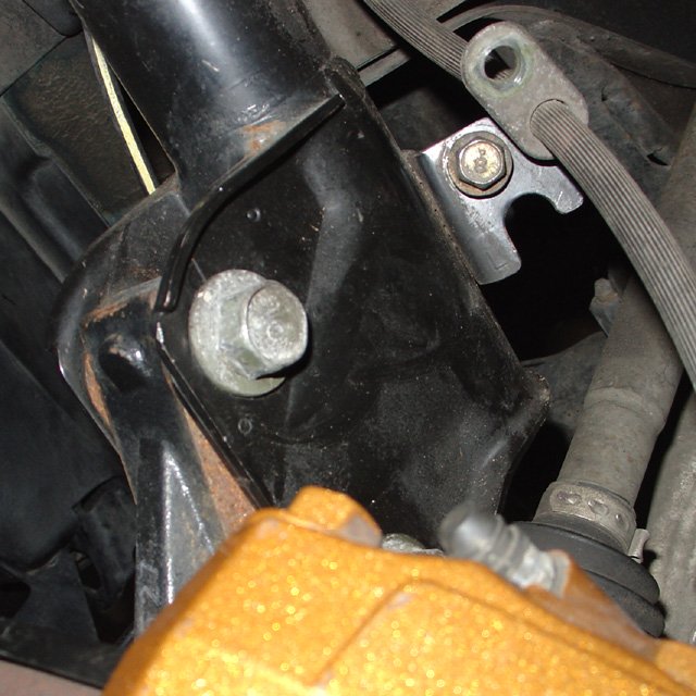 Spring: First, note the position of the camber bolt (top bolt in the front.)