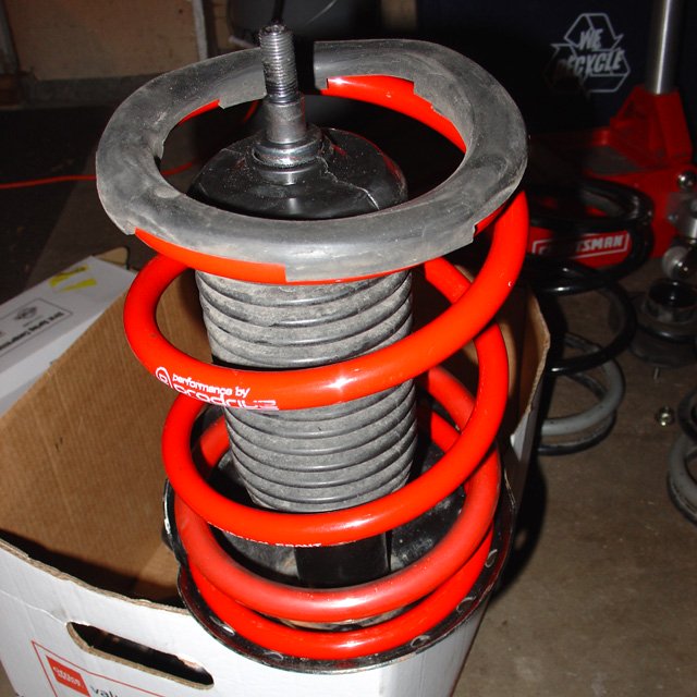 Spring: The center hole on the top perch should align with the flange at the bottom