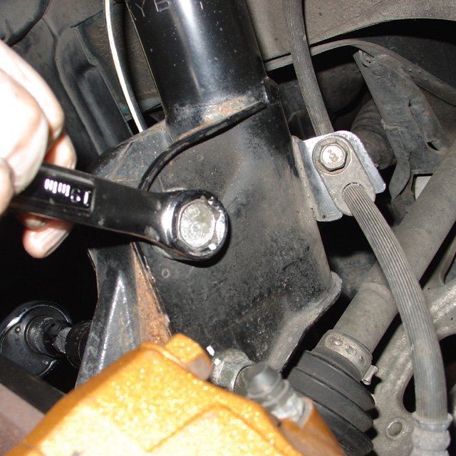 Spring: Make sure the front camber bolt is positioned where you want it before tightening.