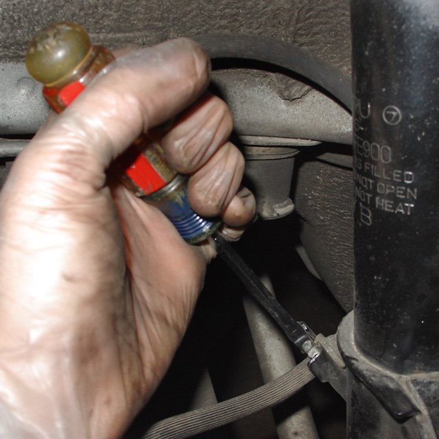 Spring: A flathead screwdriver can help position the clip, tap it in with a hammer.