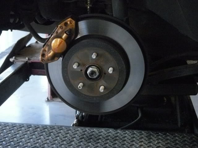 Rear Wheel bearing: Remove your wheel and Locate your axle nut and "uncrimp" it.