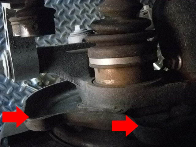 - Now, located behind everything are two bolts holding your caliper on. Remove two bolts and set bracket aside. (Make sure your caliper is in a safe place, not dangling around)