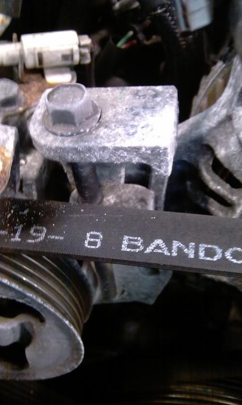 Alternator Replacement Subaru WRX/STi: Find this bolt/bracket that's right behind the belt.