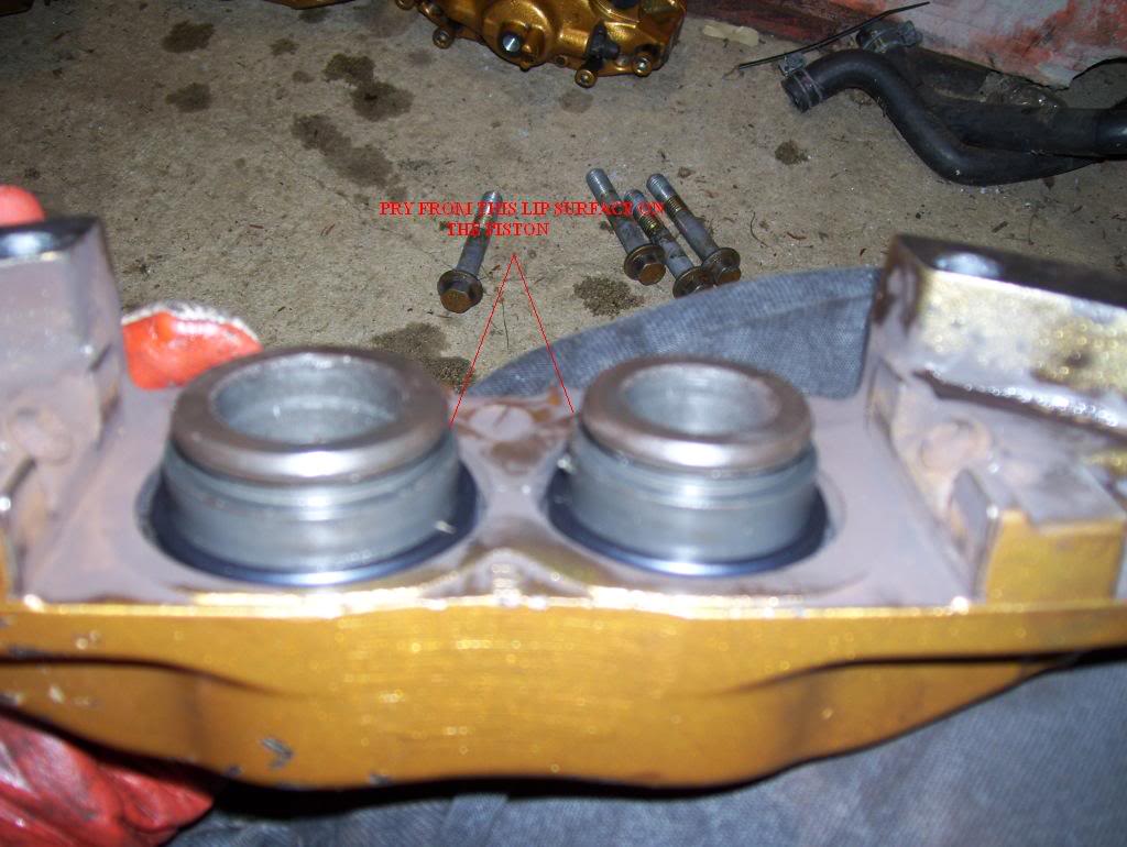 Brembo Caliper: Inserting the pistons with new o-rings into the caliper.