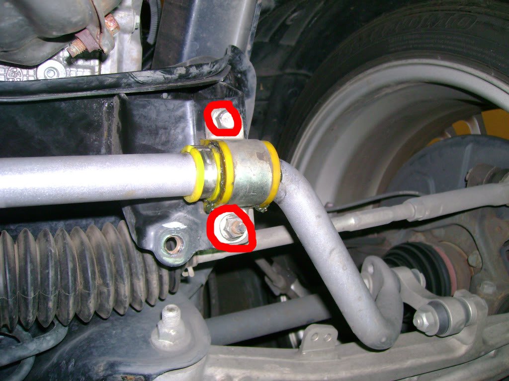 Subaru STi: Remove front swaybar D-brackets by removing 12mm bolts and 12mm nuts (one each per side, shown below on driver side).