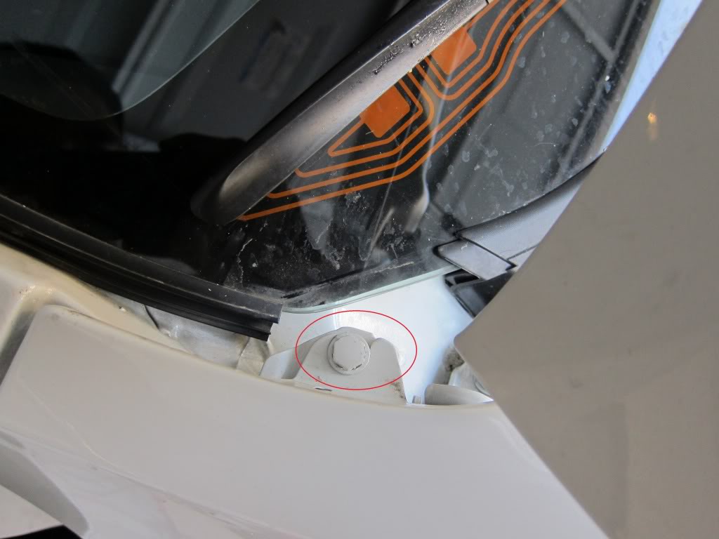 Subaru STi GR: Remove the black plastic shielding on the windshield to uncover another hidden bolt. 