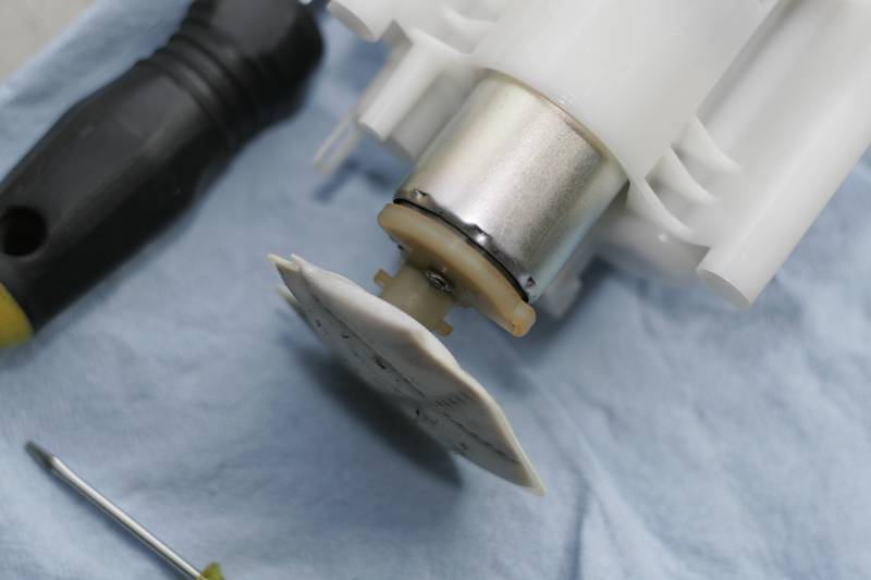 Fuel Pump: Use a small flathead to pry this off and remove the filter. Place both aside for further use later.