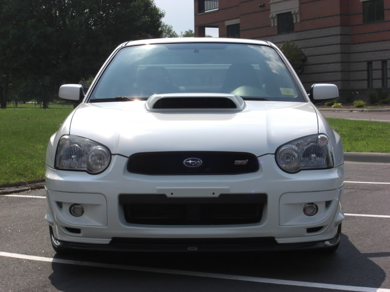 A blobeye STi with modified headlights that's had it's amber turn signals removed.