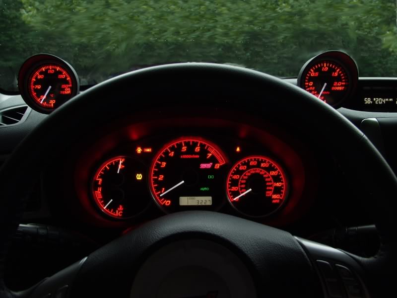 Boost Gauge: A installed boost gauge in a GR STi.