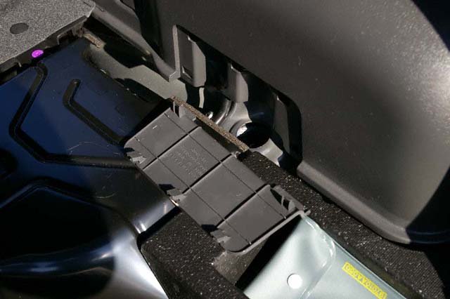 Rear strut brace install on Subaru WRX/STi 08+: Remove these panels both both sides with your hands. If you can't do that gently use a screwdriver to remove.