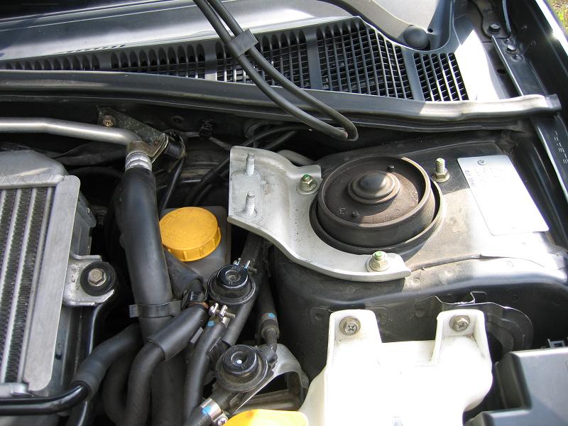 Strut Tower Brace: Driver's side strut bar end installed.