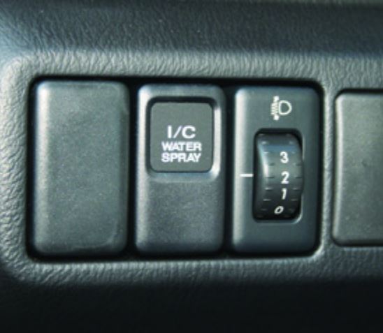 Subaru Turbocharger: The intercooler water spray system activation button, found on 2004 and later STi models, is located on the left side of the steering wheel.