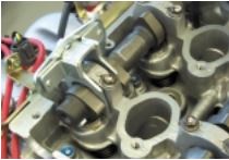 Valve Adjustment Tool and Adjustment Procedures: As we mentioned, it takes a special tool to work within the limited clearance area between the cylinder heads and the frame rails. 